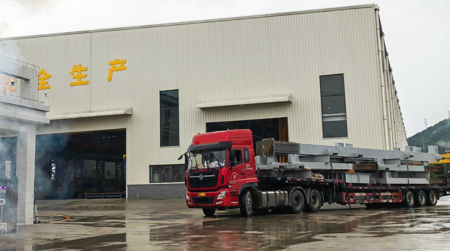 Finished steel members loaded onto a truck at the Genhong works gate